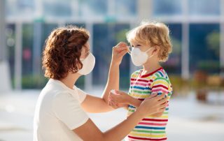 boy putting on mask to enter best pediatric allergist near me