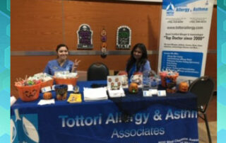 las vegas allergy doctor and nurses at table at health fair